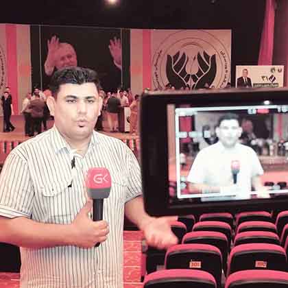 Azad Shukr pictured during a live broadcast for Gali Kurdistan TV.